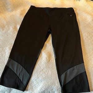 Fitted black Capri length leggings.